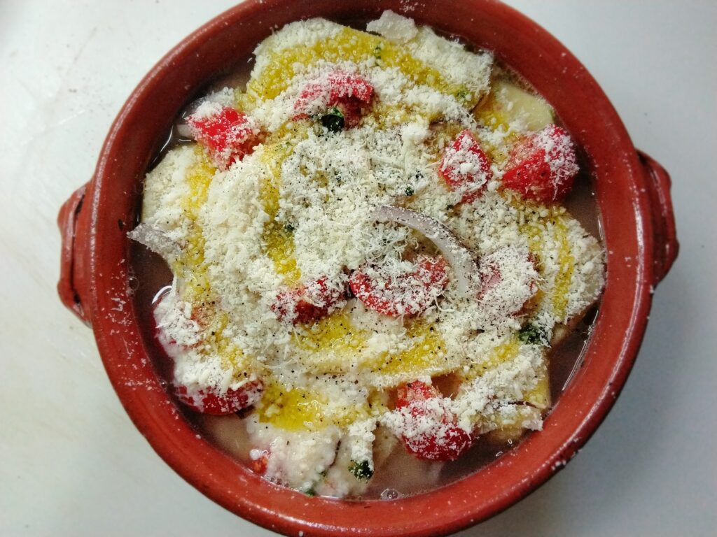 Tiella di patate riso e polpo cruda