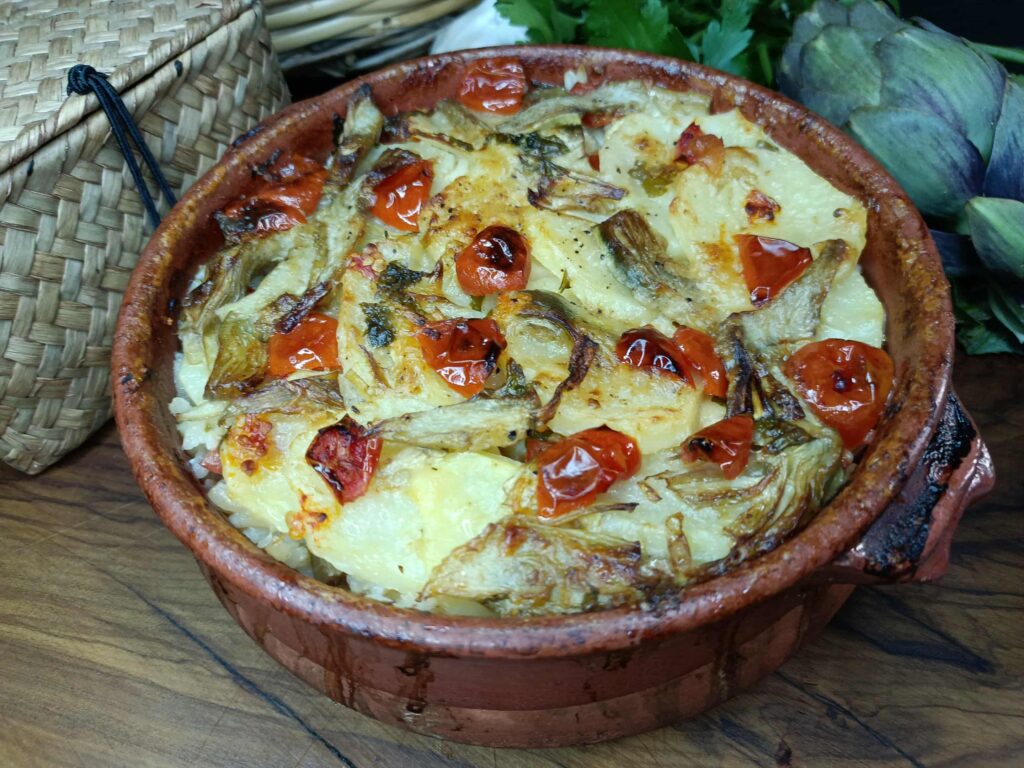 Tiella di riso patate carciofi e baccalà
