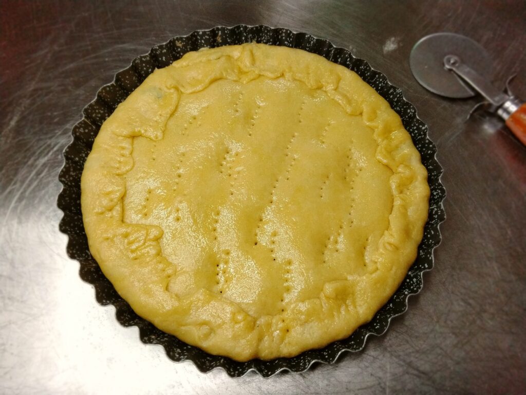 Pizza rustica salsiccia e zucchine cruda